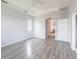 Bright bedroom features a ceiling fan, archway, and doorway to bathroom at 11715 Summer Springs Dr, Riverview, FL 33579