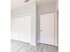 Bedroom with a closet and wood-look tile flooring at 11715 Summer Springs Dr, Riverview, FL 33579