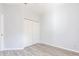 Bedroom features closet and light gray wood-look tile flooring at 11715 Summer Springs Dr, Riverview, FL 33579