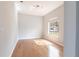 Bright bedroom with wood floors and a large window allowing natural light at 11715 Summer Springs Dr, Riverview, FL 33579