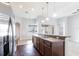 Bright kitchen features stainless steel appliances, wood cabinets, and pendant lighting at 11715 Summer Springs Dr, Riverview, FL 33579