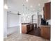 Stylish kitchen with dark wood cabinets, modern appliances, breakfast bar and eat in space at 11715 Summer Springs Dr, Riverview, FL 33579