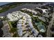 Aerial view of community, showing tennis courts and pools at 1228 Siesta Bayside Dr # 1228-C, Sarasota, FL 34242