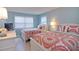 Guest bedroom with two twin beds, perfect for overnight visitors at 1228 Siesta Bayside Dr # 1228-C, Sarasota, FL 34242