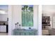 Console table with artwork, candles, and decorative bowl at 1228 Siesta Bayside Dr # 1228-C, Sarasota, FL 34242