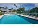 Refreshing community pool with plenty of lounge chairs at 1228 Siesta Bayside Dr # 1228-C, Sarasota, FL 34242