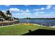 Relaxing waterfront deck with benches overlooking the water at 1228 Siesta Bayside Dr # 1228-C, Sarasota, FL 34242