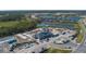Community clubhouse and pool under construction with surrounding homes and lakes at 13608 Sunset Sapphire Ct, Parrish, FL 34219