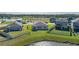 Aerial view of houses with backyard lake views in a residential area at 13608 Sunset Sapphire Ct, Parrish, FL 34219