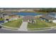 Aerial view of house near a lake at 13608 Sunset Sapphire Ct, Parrish, FL 34219