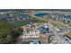 Community clubhouse and pool under construction with surrounding homes and lakes at 13608 Sunset Sapphire Ct, Parrish, FL 34219