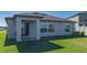 Private backyard with patio and grassy area at 13608 Sunset Sapphire Ct, Parrish, FL 34219