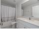 Clean bathroom with white vanity, quartz countertop and shower/tub combo at 13608 Sunset Sapphire Ct, Parrish, FL 34219