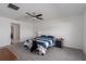 Bright bedroom with a double bed and ceiling fan at 13608 Sunset Sapphire Ct, Parrish, FL 34219