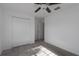Well-lit bedroom featuring a double door closet and window at 13608 Sunset Sapphire Ct, Parrish, FL 34219