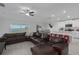 Living room features a sectional sofa and water views at 13608 Sunset Sapphire Ct, Parrish, FL 34219