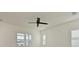 Bright bedroom with ceiling fan and window shutters at 13619 Old Creek Ct, Parrish, FL 34219