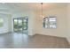 Casual dining area with sliding doors to lanai and water views at 13619 Old Creek Ct, Parrish, FL 34219