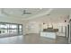 Open concept kitchen with white cabinets and island at 13619 Old Creek Ct, Parrish, FL 34219