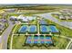 Aerial view of community amenities including tennis courts, pools, and clubhouse at 14824 Lyla Ter, Bradenton, FL 34211