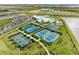 Aerial view of community amenities including pool, tennis, and courts at 14824 Lyla Ter, Bradenton, FL 34211