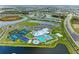 Aerial view of community with clubhouse, pools, and sports courts at 14824 Lyla Ter, Bradenton, FL 34211