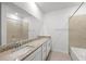 Bathroom with granite countertop, single sink vanity and shower/tub at 14824 Lyla Ter, Bradenton, FL 34211