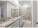 Clean bathroom with double vanity, granite countertop and shower at 14824 Lyla Ter, Bradenton, FL 34211