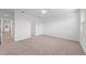 Bright and airy bedroom with carpeted floor and an adjacent hallway at 14824 Lyla Ter, Bradenton, FL 34211