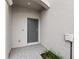 Front entry with gray door, tile flooring, and sidelights at 14824 Lyla Ter, Bradenton, FL 34211