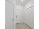 Interior entryway with white doors and tile flooring at 14824 Lyla Ter, Bradenton, FL 34211