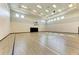Bright and spacious indoor basketball court with hardwood flooring at 14824 Lyla Ter, Bradenton, FL 34211