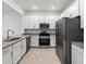 Modern kitchen with stainless steel appliances and granite countertops at 14824 Lyla Ter, Bradenton, FL 34211
