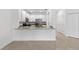 Kitchen with granite countertop island and white cabinets at 14824 Lyla Ter, Bradenton, FL 34211