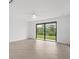 Living room with tile floors and sliding glass doors leading outside at 14824 Lyla Ter, Bradenton, FL 34211