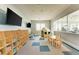 Inviting playroom with toys, a playhouse, and a large screen TV at 14824 Lyla Ter, Bradenton, FL 34211