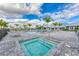 Community pool and spa with lounge chairs and palm trees at 14824 Lyla Ter, Bradenton, FL 34211