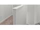 Simple staircase with carpeted steps and a white railing at 14824 Lyla Ter, Bradenton, FL 34211