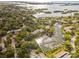 Aerial view of community marina with numerous boats and lush surroundings at 1512 Pelican Cove Rd # 239, Sarasota, FL 34231