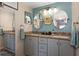 Elegant bathroom with double vanity, granite countertops and updated fixtures at 1512 Pelican Cove Rd # 239, Sarasota, FL 34231