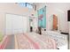 Charming bedroom with white dresser and large closet at 1512 Pelican Cove Rd # 239, Sarasota, FL 34231