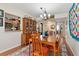 Bright dining area with a view to the kitchen and entryway at 1512 Pelican Cove Rd # 239, Sarasota, FL 34231