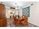 Charming dining room with wood table and mid-century hutch at 1512 Pelican Cove Rd # 239, Sarasota, FL 34231