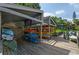 Covered kayak storage area on a wooden dock at 1512 Pelican Cove Rd # 239, Sarasota, FL 34231