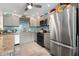 Modern kitchen with stainless steel appliances and granite countertops at 1512 Pelican Cove Rd # 239, Sarasota, FL 34231