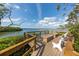 Relaxing waterfront deck with benches and stunning views at 1512 Pelican Cove Rd # 239, Sarasota, FL 34231