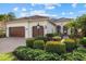 Single-Gathering home with two-car garage and landscaping at 15608 Leven Links Pl, Lakewood Ranch, FL 34202