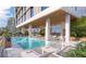 Modern rooftop pool with lounge chairs at 1703 Main St # 1103, Sarasota, FL 34236