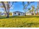 Home exterior view with large backyard at 1732 Jagust Rd, North Port, FL 34288