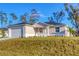 Charming single-story home with attached garage and freshly landscaped front yard at 1732 Jagust Rd, North Port, FL 34288